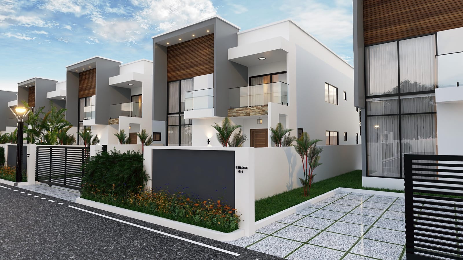 Front street view of The Kharis residences with manicured gardens and modern facades