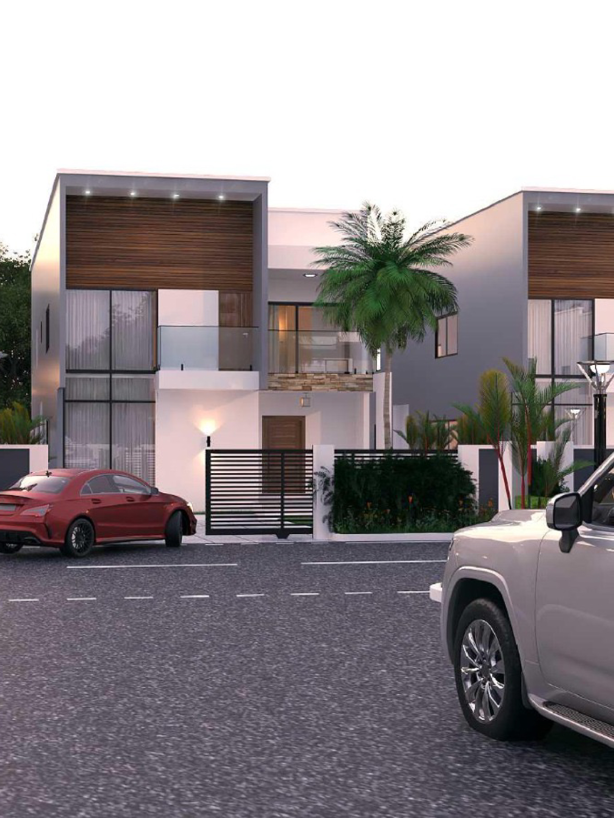 Two Best World villas at dusk with timber accents and a private gate