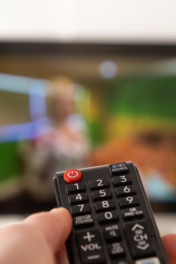 Hand on a backup-power remote at The Kharis