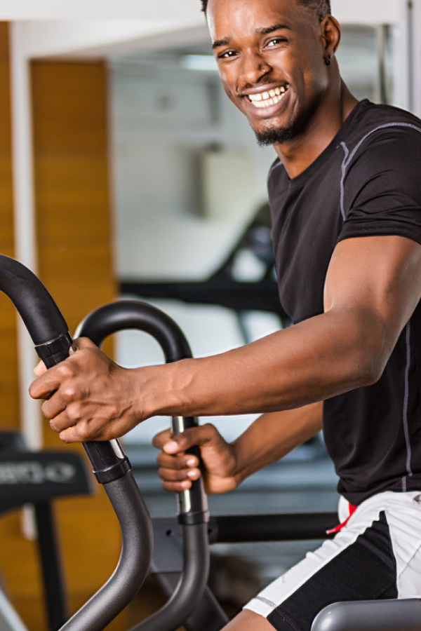 Resident training inside The Kharis on-site fitness centre