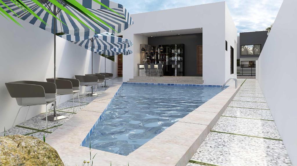 The Kharis community pool and lounge bar