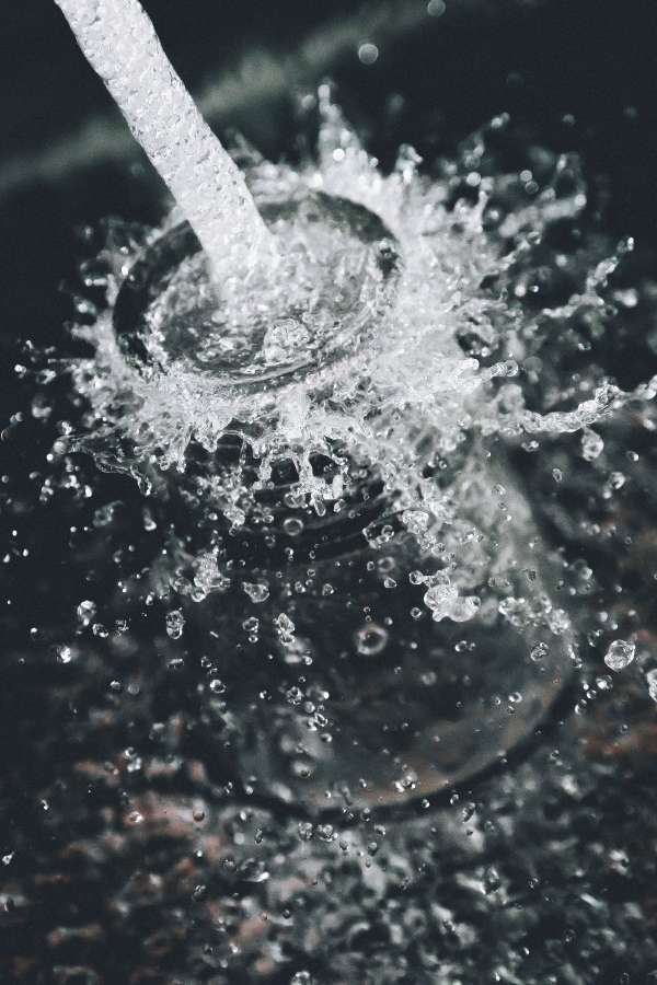 Clean water pouring from a tap at The Kharis